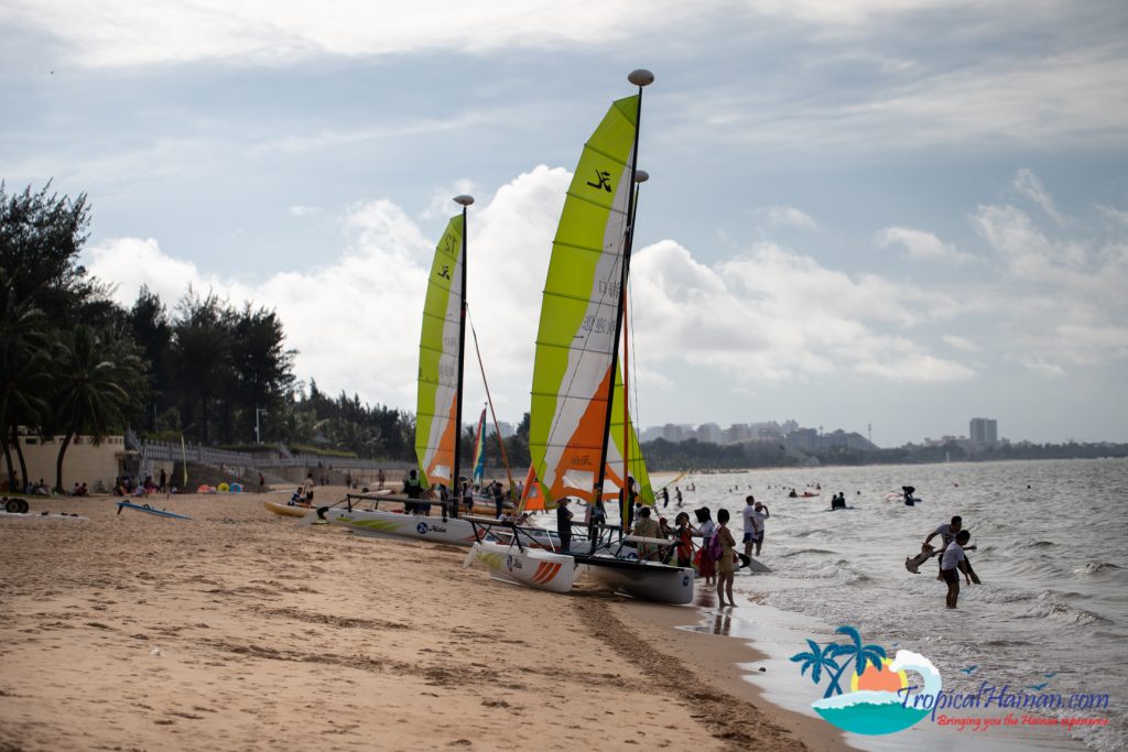 photo of beach full of people hainan island