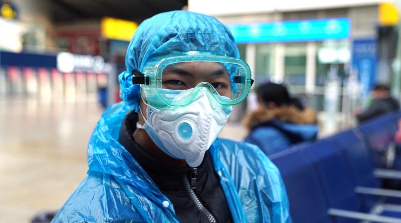 Travelers in Beijing are wrapping themselves in plastic to avoid getting infected