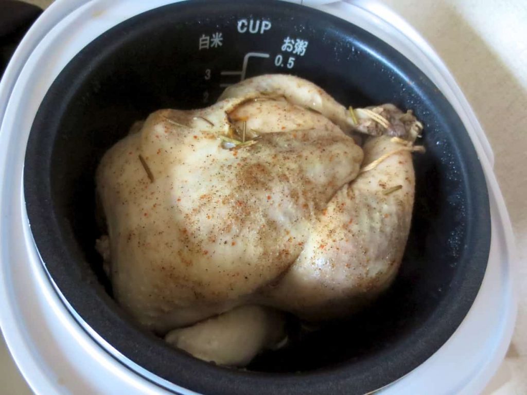 Place the chicken in the rice cooker