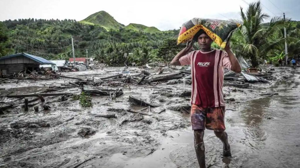 Dozens are feared dead in the village of Kusiong in the southern Philippines after it was hit by a mudslide during tropical storm 2