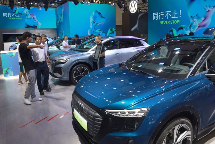 Vehicles on display at the 2024 World New Energy Vehicles Congress in Haikou